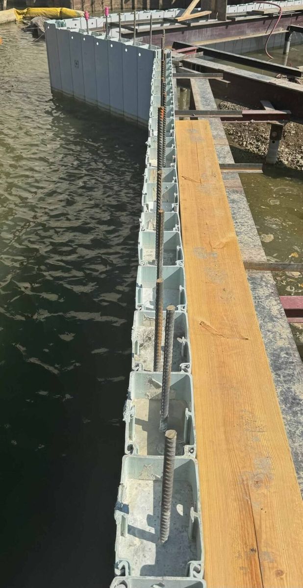 Truline vinyl seawall cells with steel rebar in place, before concrete pour